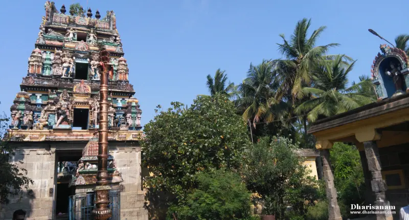 The sculptured tower behind a tall metal flagstaff