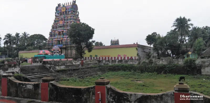 Steps of a green-edged tank in the foreground, with a painted tower rising behind it